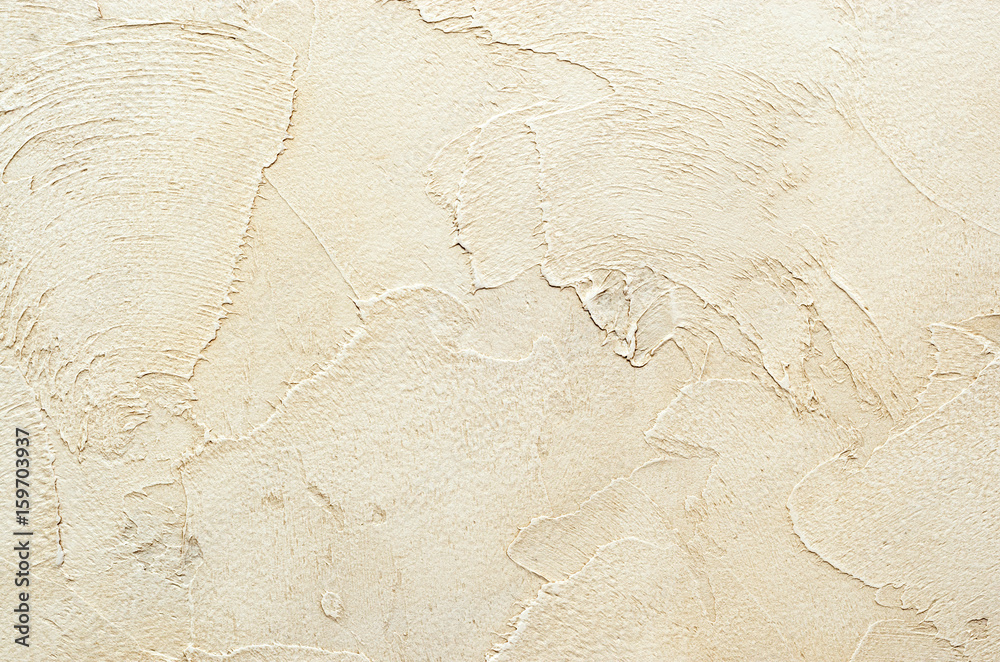 Fototapeta premium Textured background. Decorative plaster walls, external decoration of facade. Texture of beige.