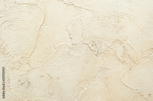 Textured background. Decorative plaster walls, external decoration of facade. Texture of beige.