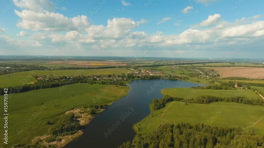 Aerial View Flying over the lake and green fields.4K video. Aerial View Flying over the lake and green fields.4K video.