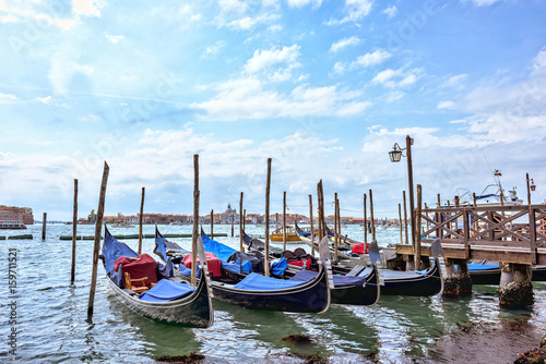 Grand canal in Venice, Piazza San Marco. On the background the island San Giorgio. Scenic cityscape with gondolas