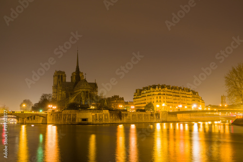 Notre Dame Cathedral with Paris cityscape at dusk © Netfalls