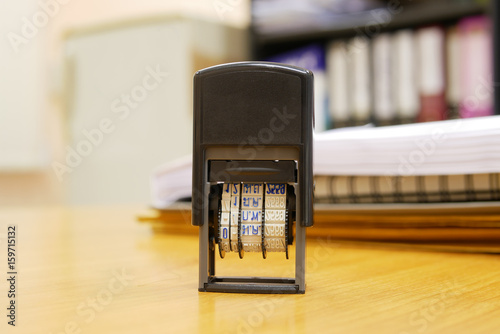Stamper on office table as selective focus