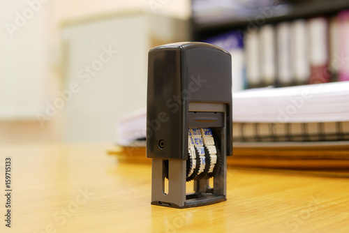 Stamper on office table as selective focus