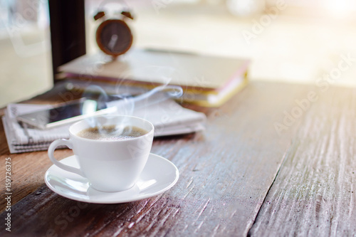 coffee cup clock and work on table