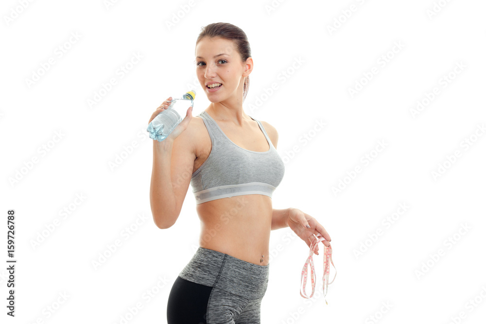 young sports woman in tight uniform drinks water young sports woman in tight uniform drinks water