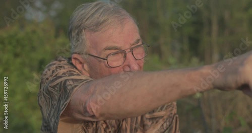 Old man hunting outdoors