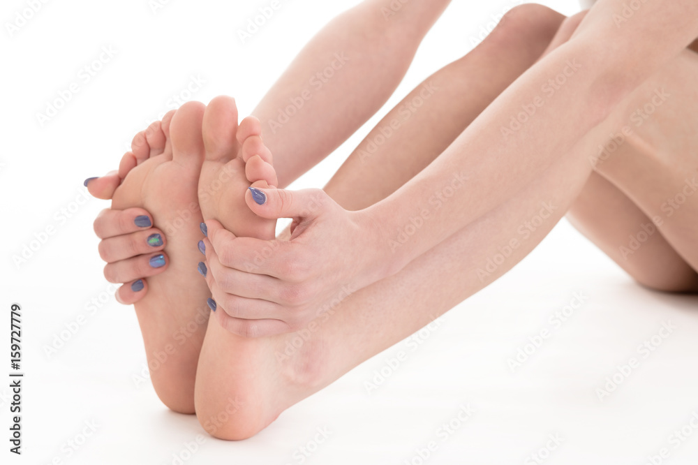Female feet and hands with manicure on white background Female feet and hands with manicure on white background