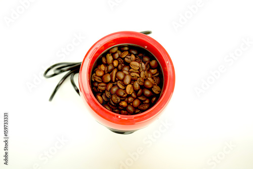 A coffee grinder with coffe beans
