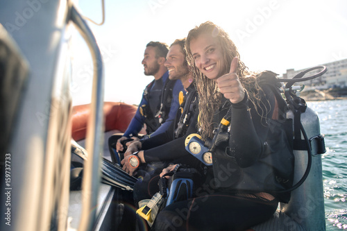 Group of scuba divers on a boat