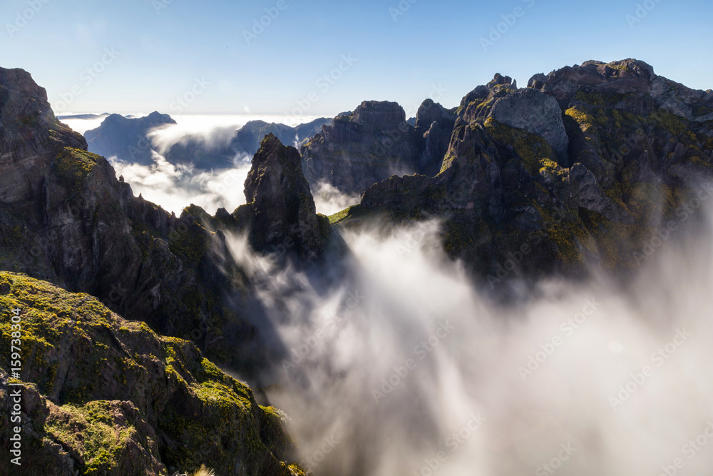 Steep mountain rock above the clouds