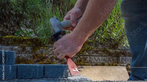 bricklayer tools man working on construction site hammering chisel