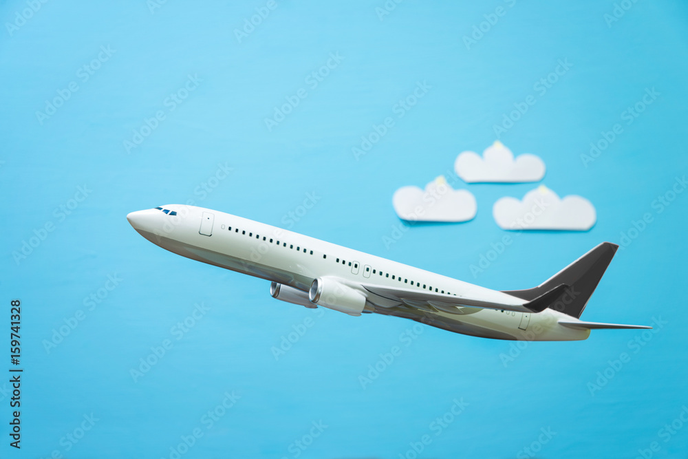 white airplane on a blue background