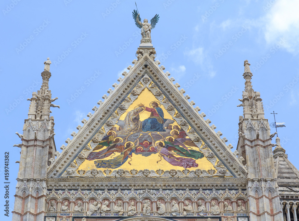Cathedral in Siena, Tuscany, Italy - large central mosaic of facade depict Coronation of  Virgin, is work of Luigi Mussini in Venice, from 1878