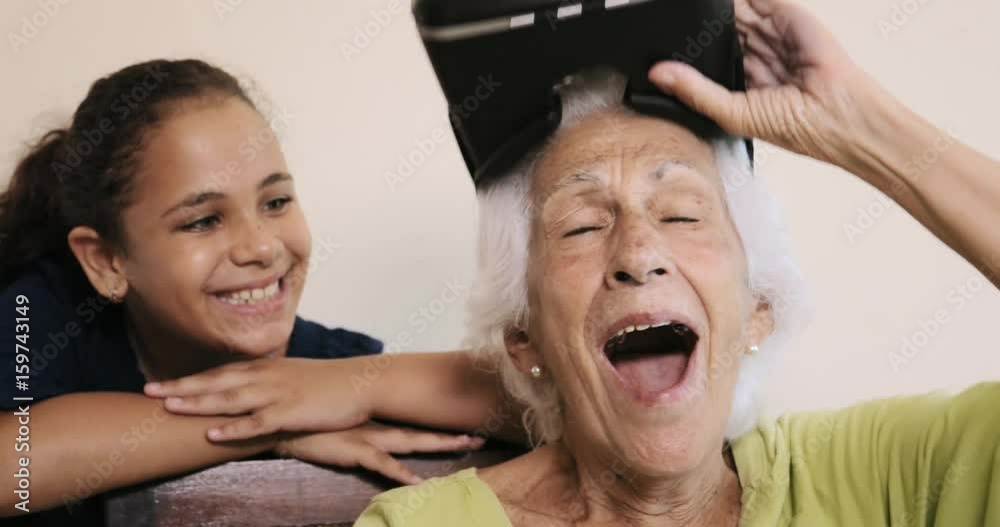 VR Game With Happy Grandma And Girl Playing Smiling Laughing VR Game With Happy Grandma And Girl Playing Smiling Laughing