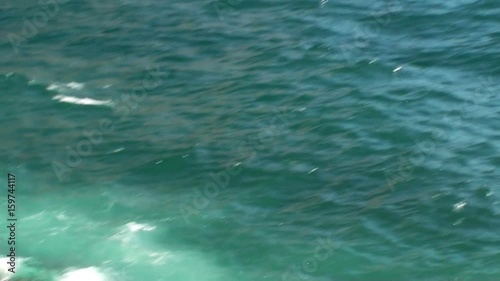 Wallpaper Mural Surf waves near a rocky shore. Seawater foams and smashes against rocks. HD 1920x1080 Video Clip Torontodigital.ca