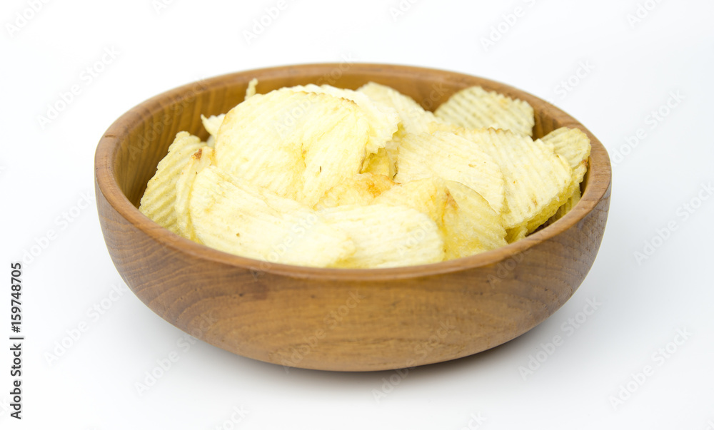 potato chips in an earthenware dish potato chips in an earthenware dish