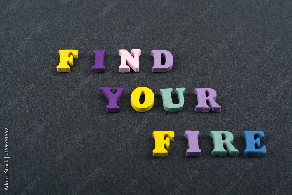 FIND YOUR FIRE word on black board background composed from colorful abc alphabet block wooden letters, copy space for ad text. Learning english concept. FIND YOUR FIRE word on black board background composed from colorful abc alphabet block wooden letters, copy space for ad text. Learning english concept.