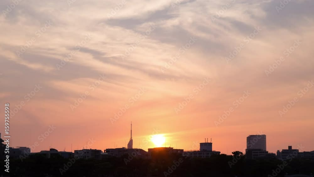 Time lapse of beautiful, urban sunset and cloudscape over skyscraper
Time lapse of beautiful, urban sunset and cloudscape over skyscraper