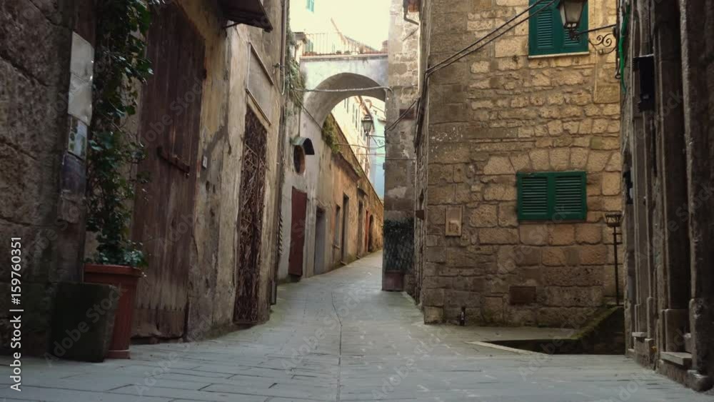 view of empty old italian street of small town
view of empty old italian street of small town