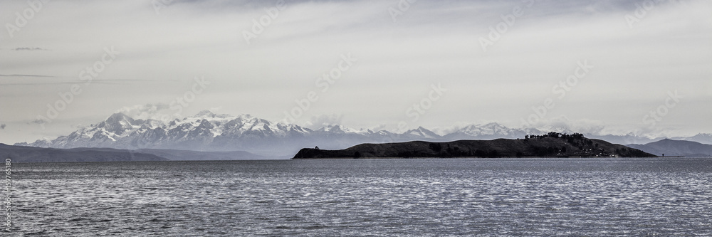 Island of the moon with snowy mountains in the background