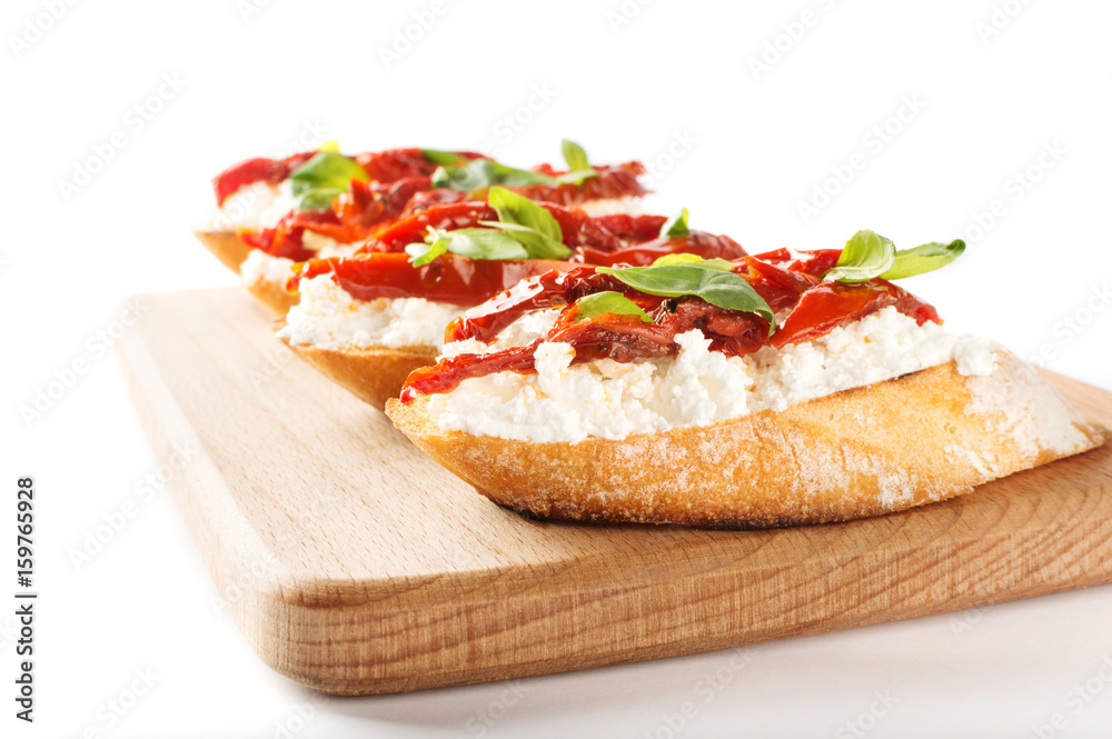 Italian sandwiches - bruschetta with cheese, tomato and basil Italian sandwiches - bruschetta with cheese, tomato and basil