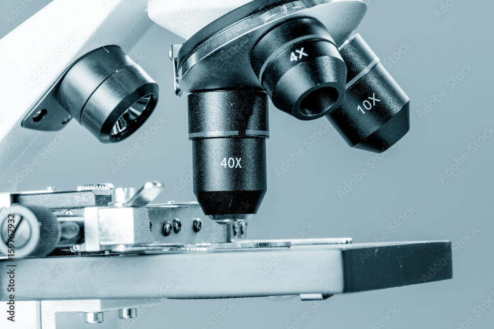 Subject table microscope and interchangeable lenses. Microscope is the main research tool in many scientific laboratories Subject table microscope and interchangeable lenses. Microscope is the main research tool in many scientific laboratories