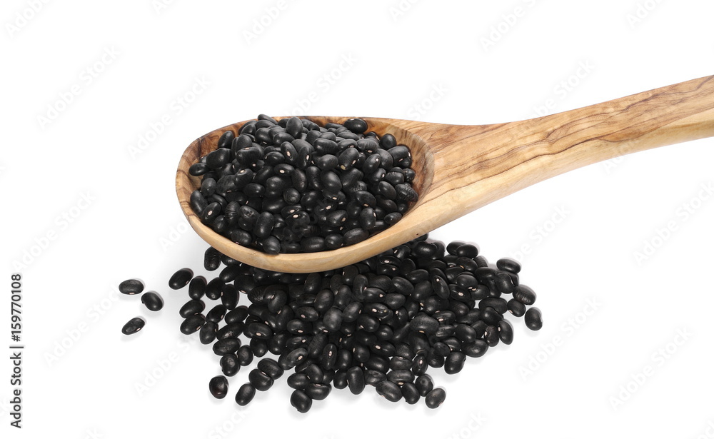 pile organic black beans with wooden spoon, isolated on white background pile organic black beans with wooden spoon, isolated on white background