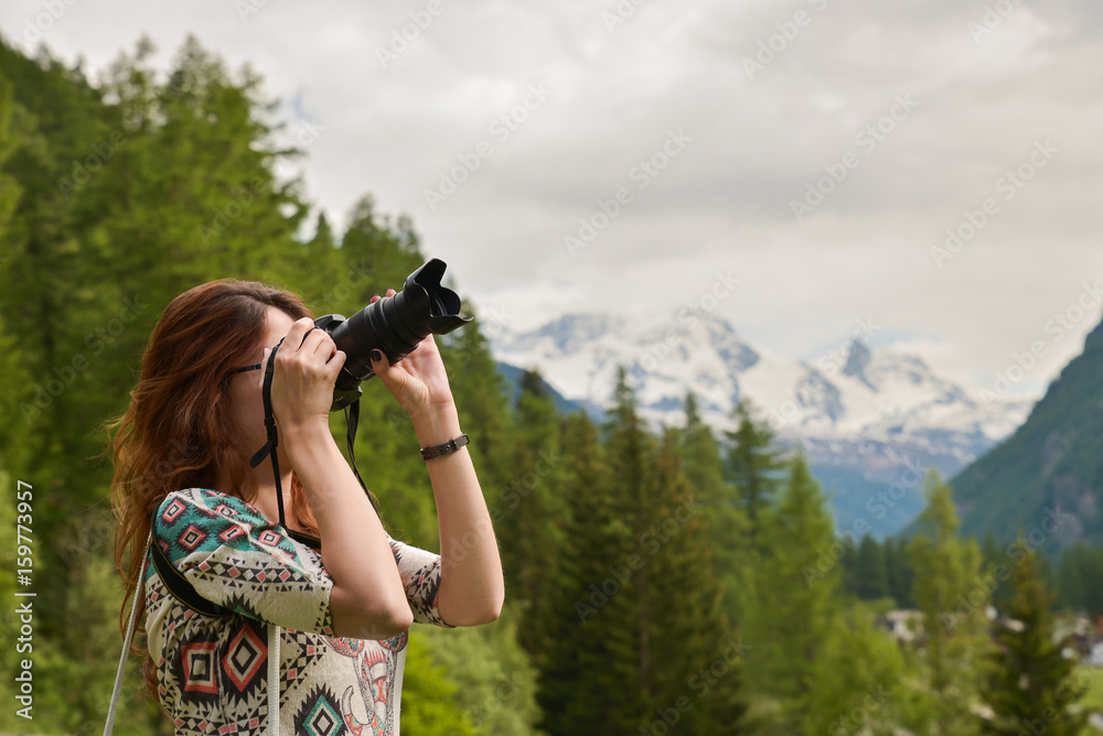 Girl taking photos in nature