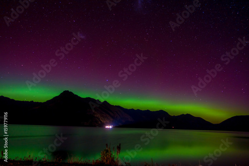 Beautiful Aurora Australis and milky way over Lake Wakatipu, Kinloch, New Zealand South Island photo