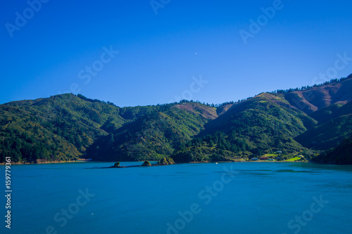 Beautiful landscape of mountain with gorgeous blue sky in a sunny day seen from ferry from north island to south island, in New Zealand © Fotos 593