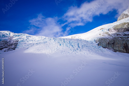 Beautiful view at white mountains covered with snow in South Westland's Southern Alps, New Zealand