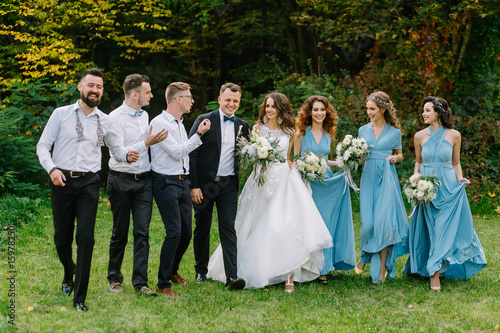 Cheerful stylish wedding for a walk in the park