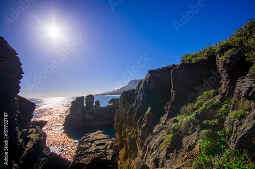 Beautiful attraction of limestone formations at Pancake Rocks with sun shine in the blue sky, Punakaiki, West Coast, South Island, New Zealand