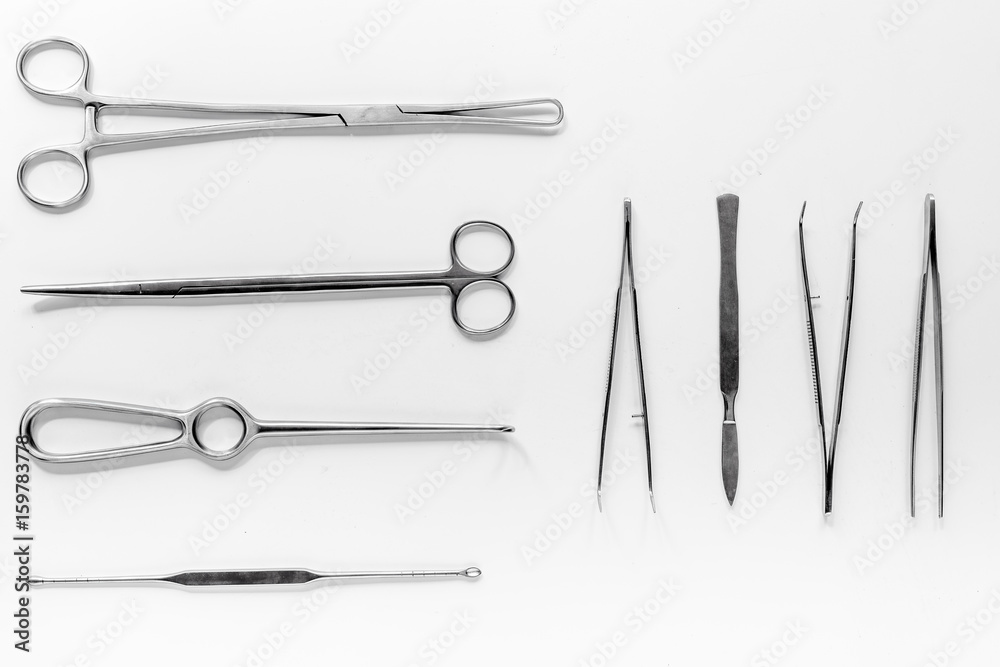 Medical instruments for plastic surgery on white backgrond top view Medical instruments for plastic surgery on white backgrond top view