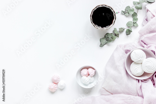 sweet lunch with marsh-mallow and spring flowers for woman on white background top view mockup