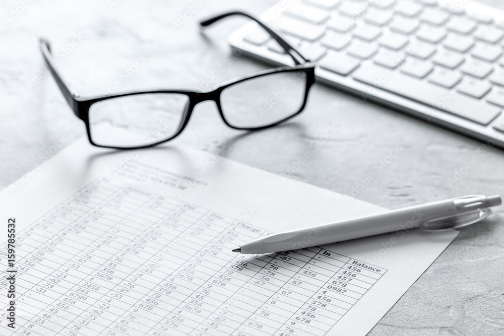 Business report preparing with calculator and glasses on office background Business report preparing with calculator and glasses on office background