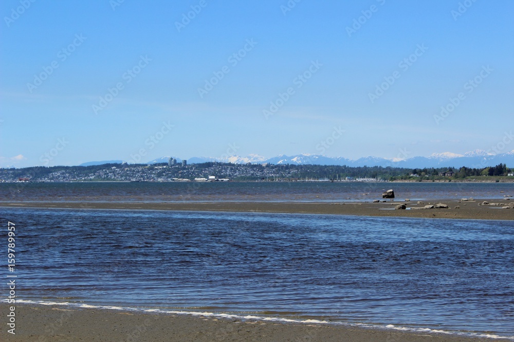 Waves move into Drayton Harbor on an early summer afternoon, with a view of White Rock in Canada Waves move into Drayton Harbor on an early summer afternoon, with a view of White Rock in Canada