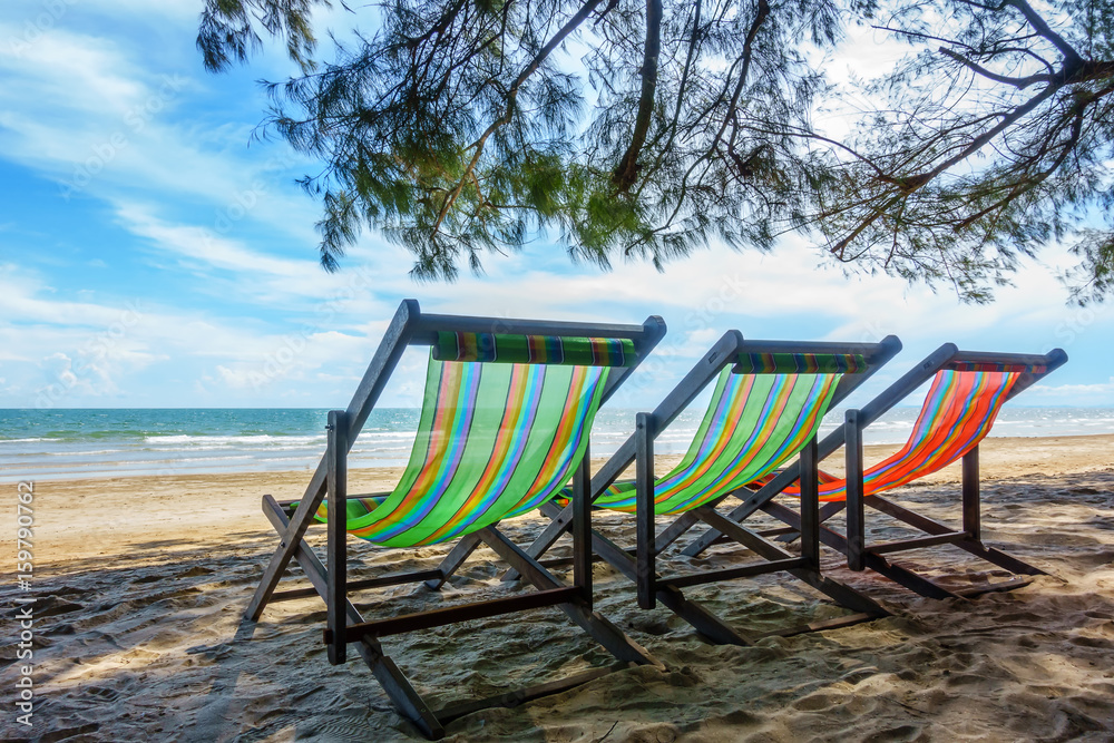 Bench chairs and white sand in summer time, Summer holiday and vacation concepts Bench chairs and white sand in summer time, Summer holiday and vacation concepts