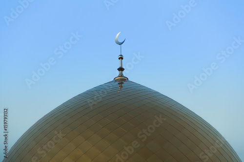 Symbol of Islam. The Golden Crescent. Golden minaret of the mosque.