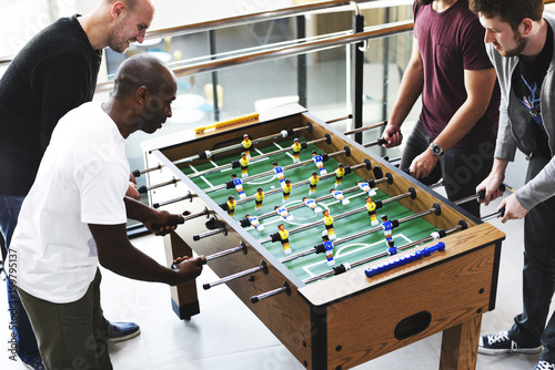 People Playing Enjoying Foosball Table Soccer Game Recreation Leisure