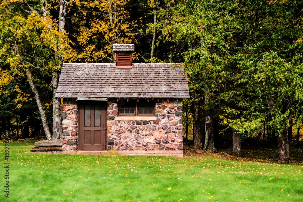 Tiny Stone House Side View Of A Tiny Stone House With Autumn Foliage In The Yard This Is A Tiny Stone House Side View Of A Tiny Stone House With Autumn Foliage In The Yard This Is A