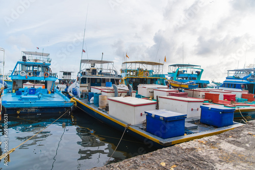 Fishing boats in the harbor in city Male, capital of Maldives