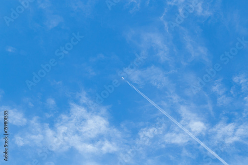 Airplane flying in the blue sky