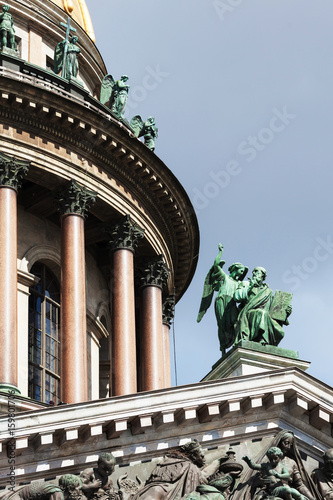 The colonnade southern facade of St. Isaac`s Cathedral with sculpture apostle Matthew and angel photo