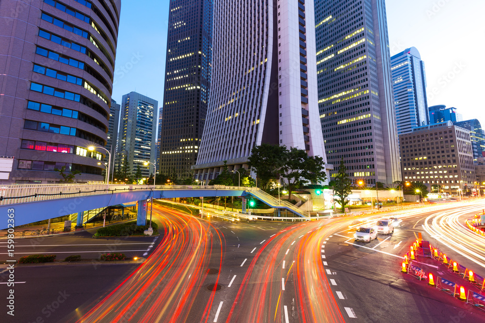 busy traffic on road in midtown of modern city busy traffic on road in midtown of modern city