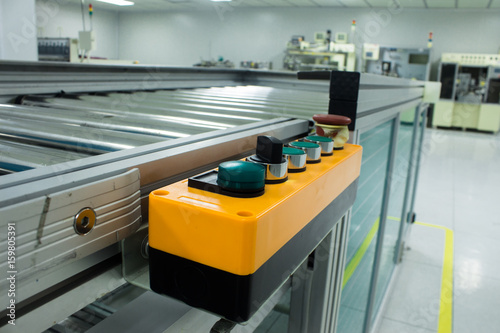 switch control panel with many buttons in conveyor line manufacturing