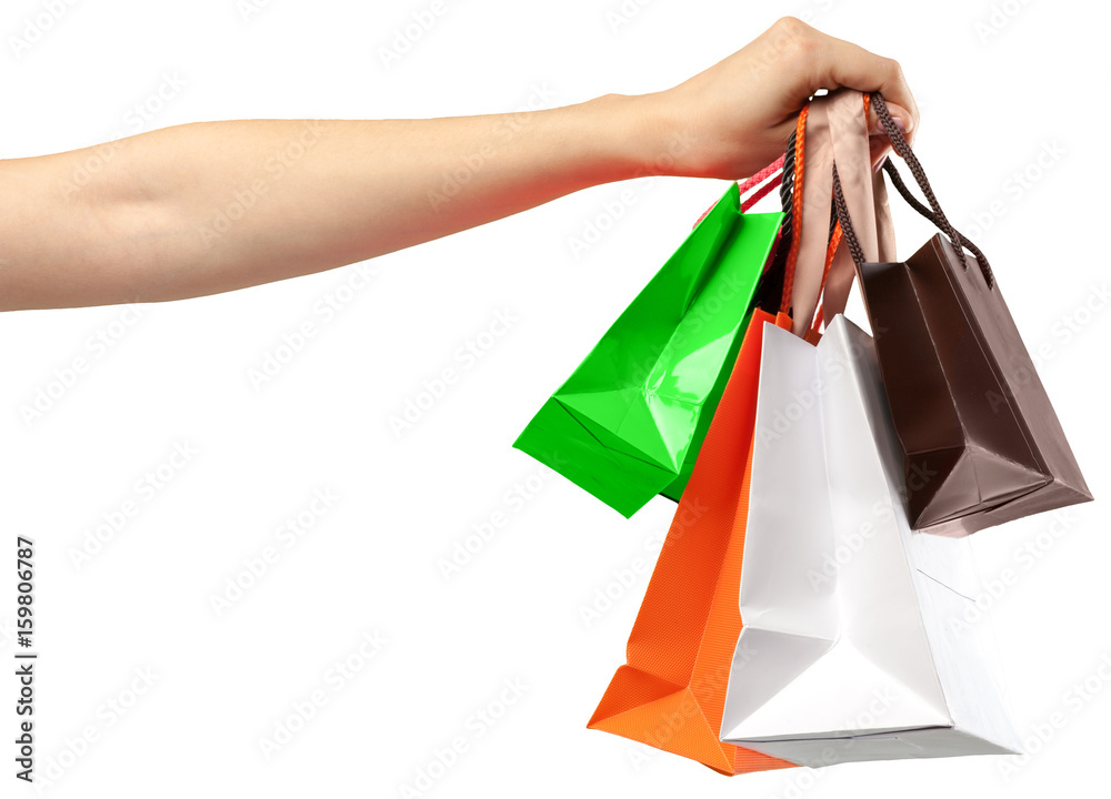 Shopping Bag. Female hand holding shopping bag on white