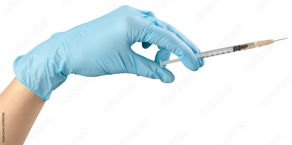 Syringe in hand isolated on white Syringe in hand isolated on white