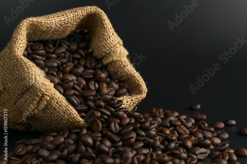 coffee beans in sack on black background