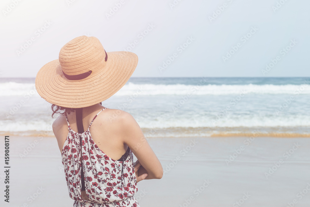 Caucasian woman or tourist from europe with happy and relax time on the tropical beach at Karon, Phuket province, Thailand